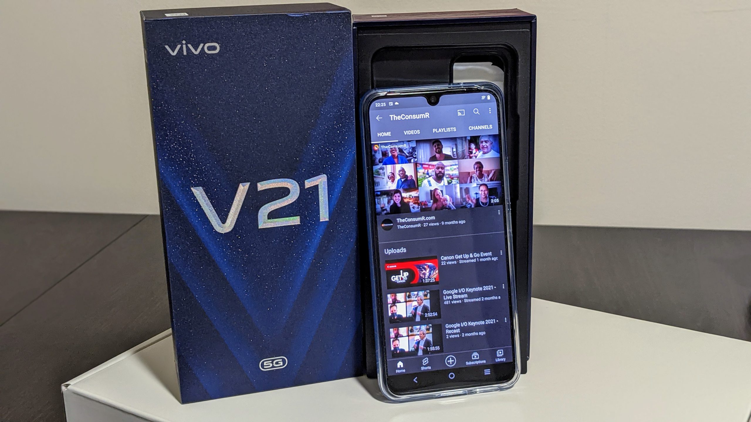 vivo v21 5g smartphone sitting on white desk no background