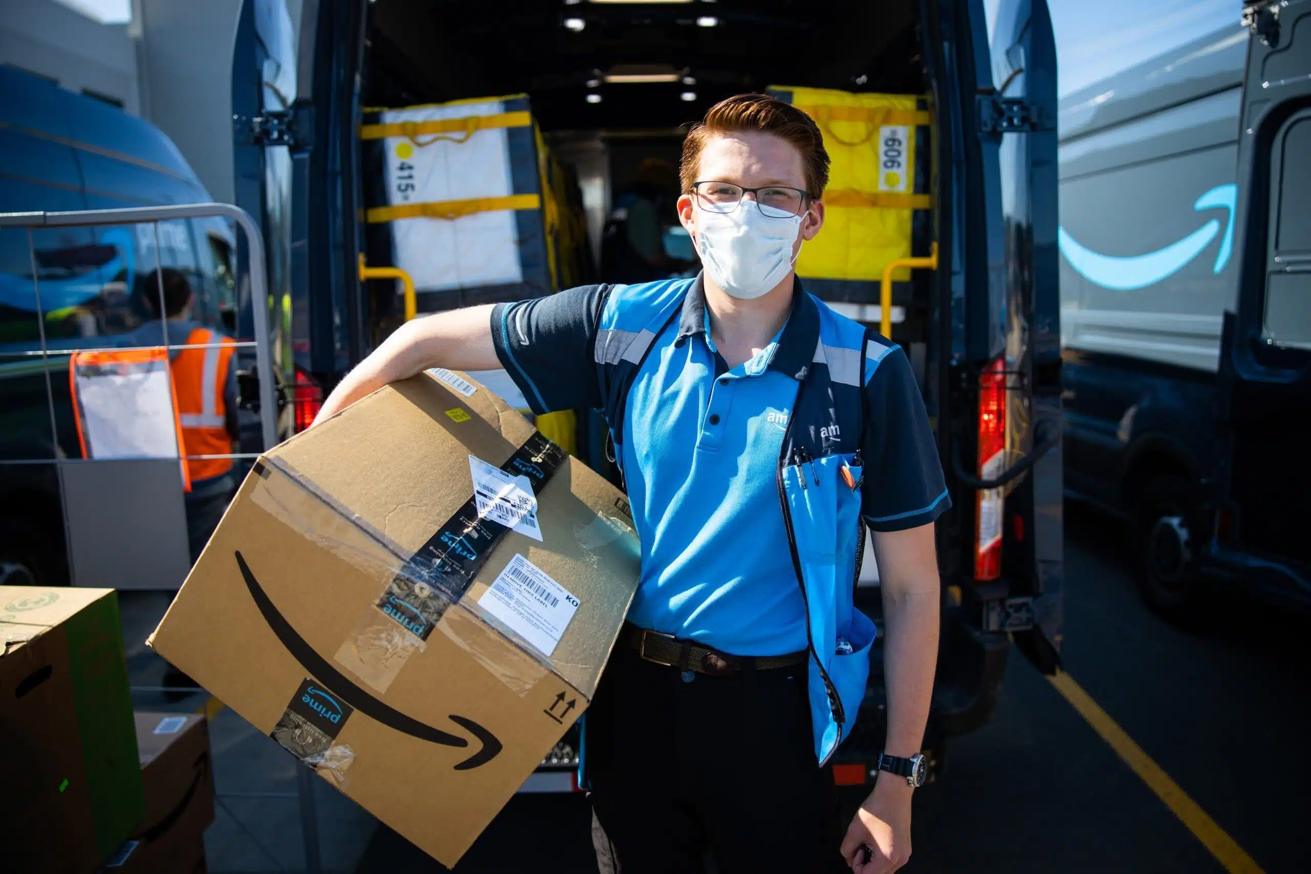 Amazon prime delivery driver with package
