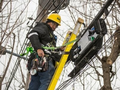 bell canada technician installing new fibre to home customer's line
