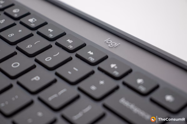 Close-up of a Logi keyboard showing the logo and media function keys