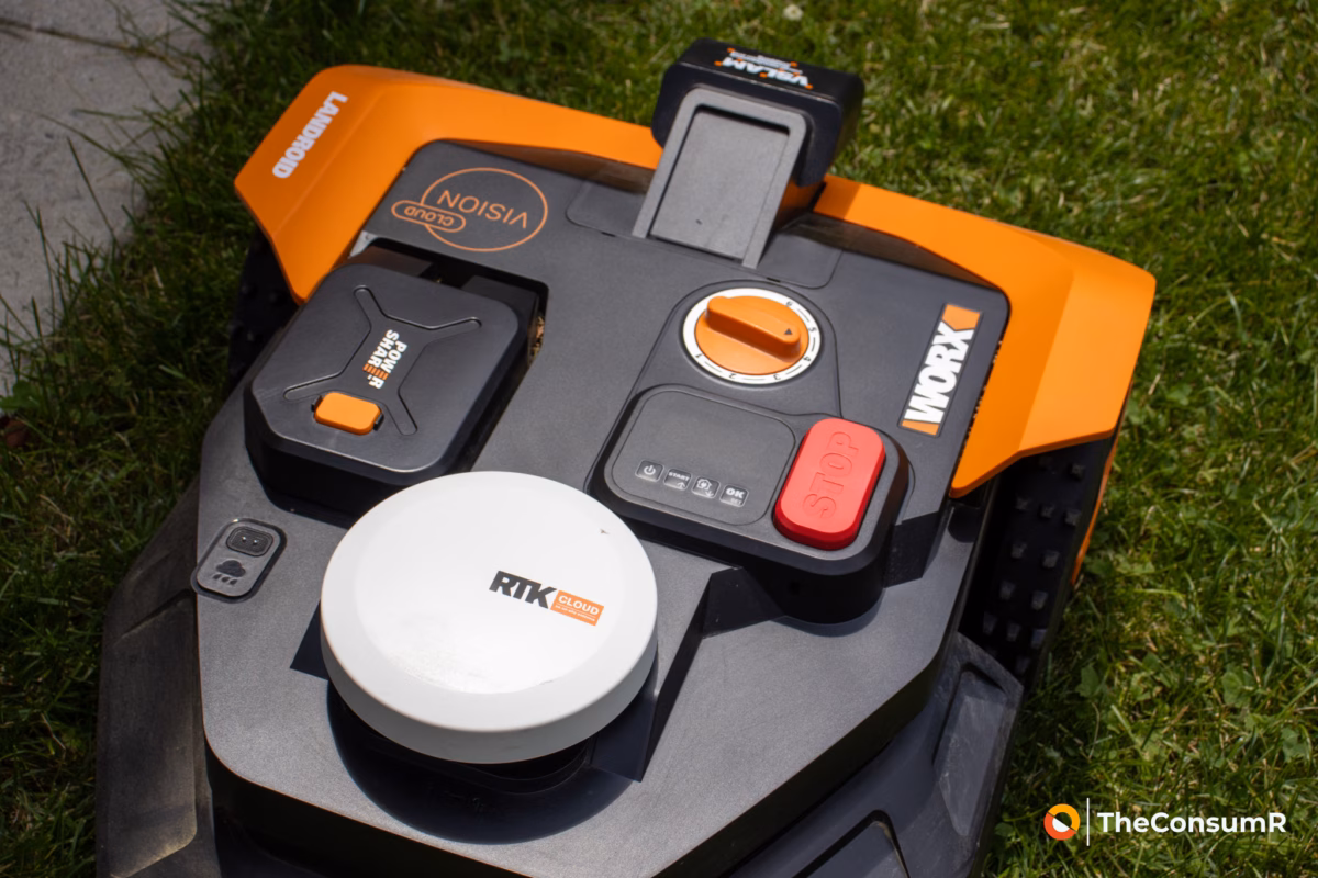 Worx Landroid Vision Cloud robotic lawn mower control panel with a red stop button and white RTK antenna