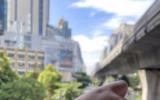 Study shows that smartwatches loose up to 60% of their value in less than 6 months 16 A close-up of a smartwatch displaying the time as 08:21:03 along with health metrics, set against a blurred background of a city street with buildings and trees.
